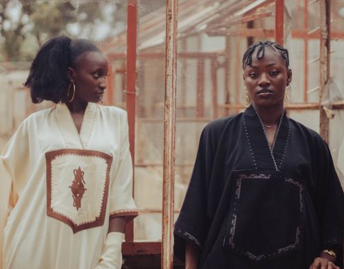 Free Portrait of two women in African attire, showcasing cultural fashion and style. Stock Photo