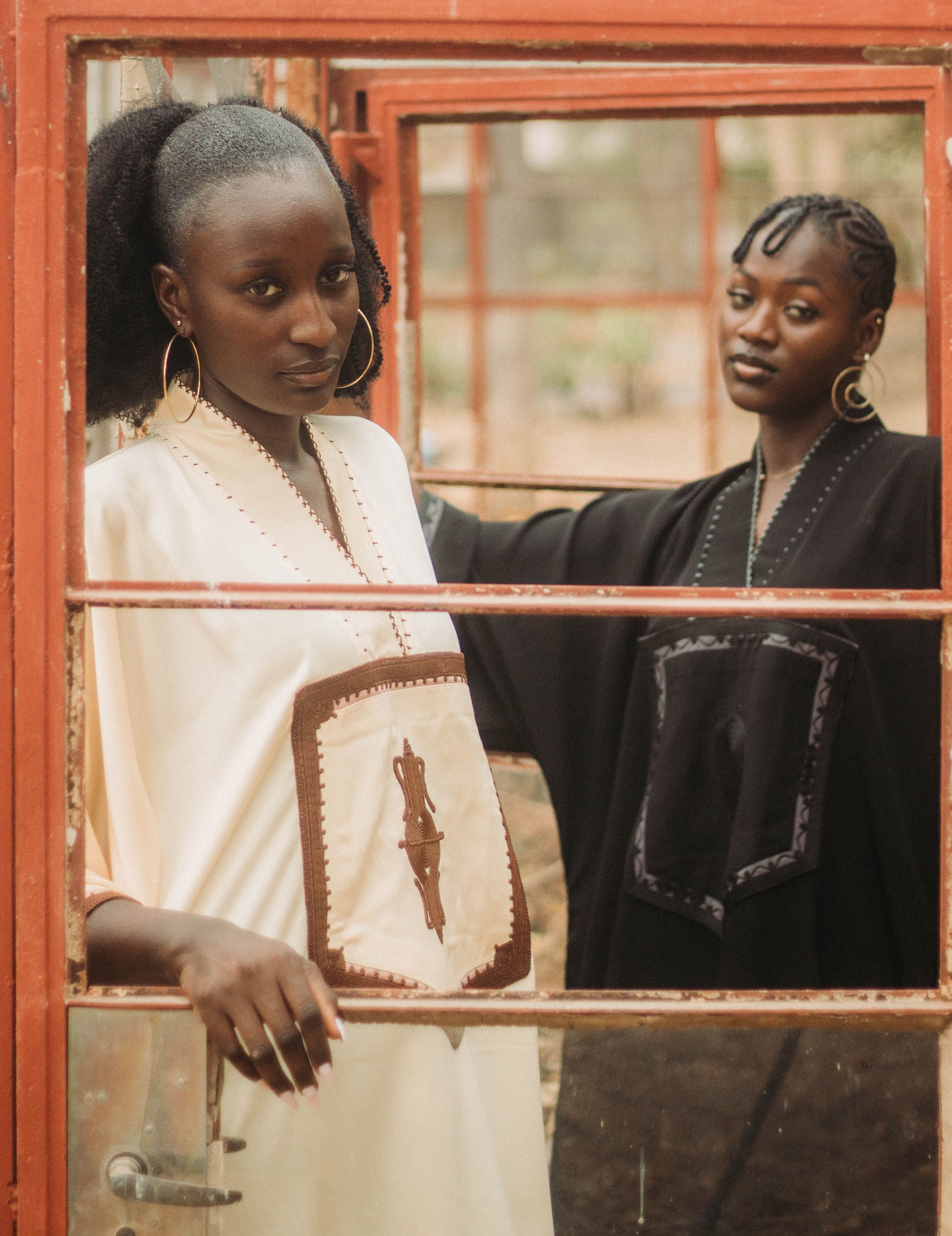 Elegant Portrait of Two Women in Traditional Attire · Free Stock Photo