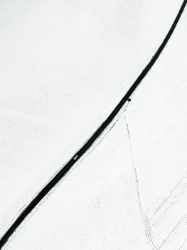 Aerial view of a minimalist snow-covered road in Gölbaşı, Adıyaman, Türkiye.