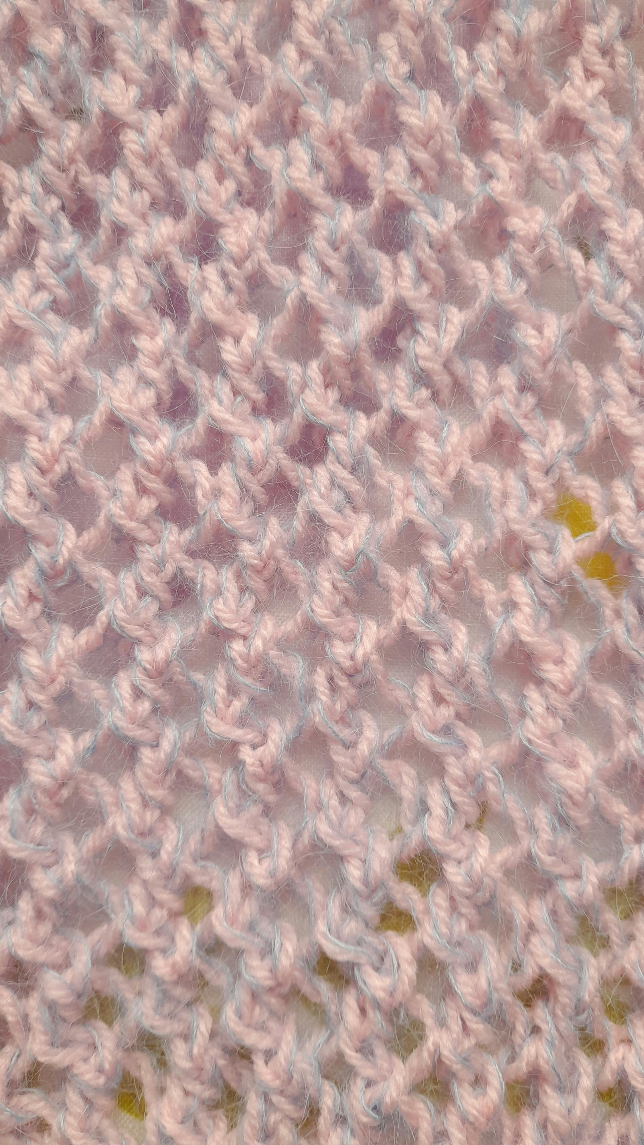 Free Detailed pink knitted fabric background showcasing fine texture and pattern. Stock Photo