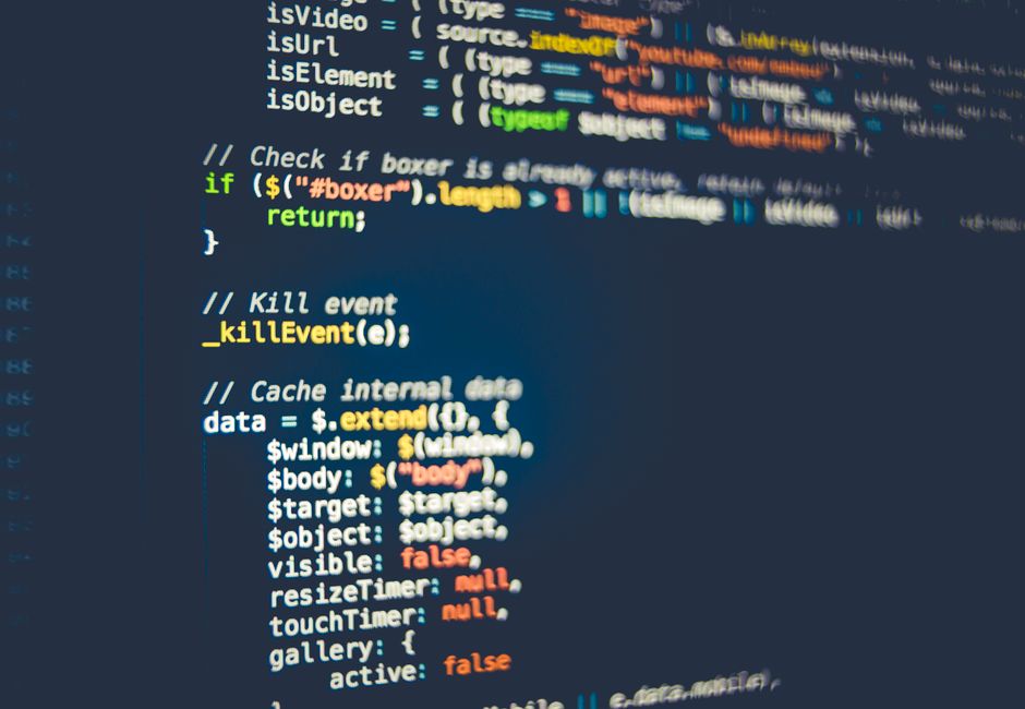 Close-up of colorful programming code displayed on a computer screen, showcasing modern coding concepts.