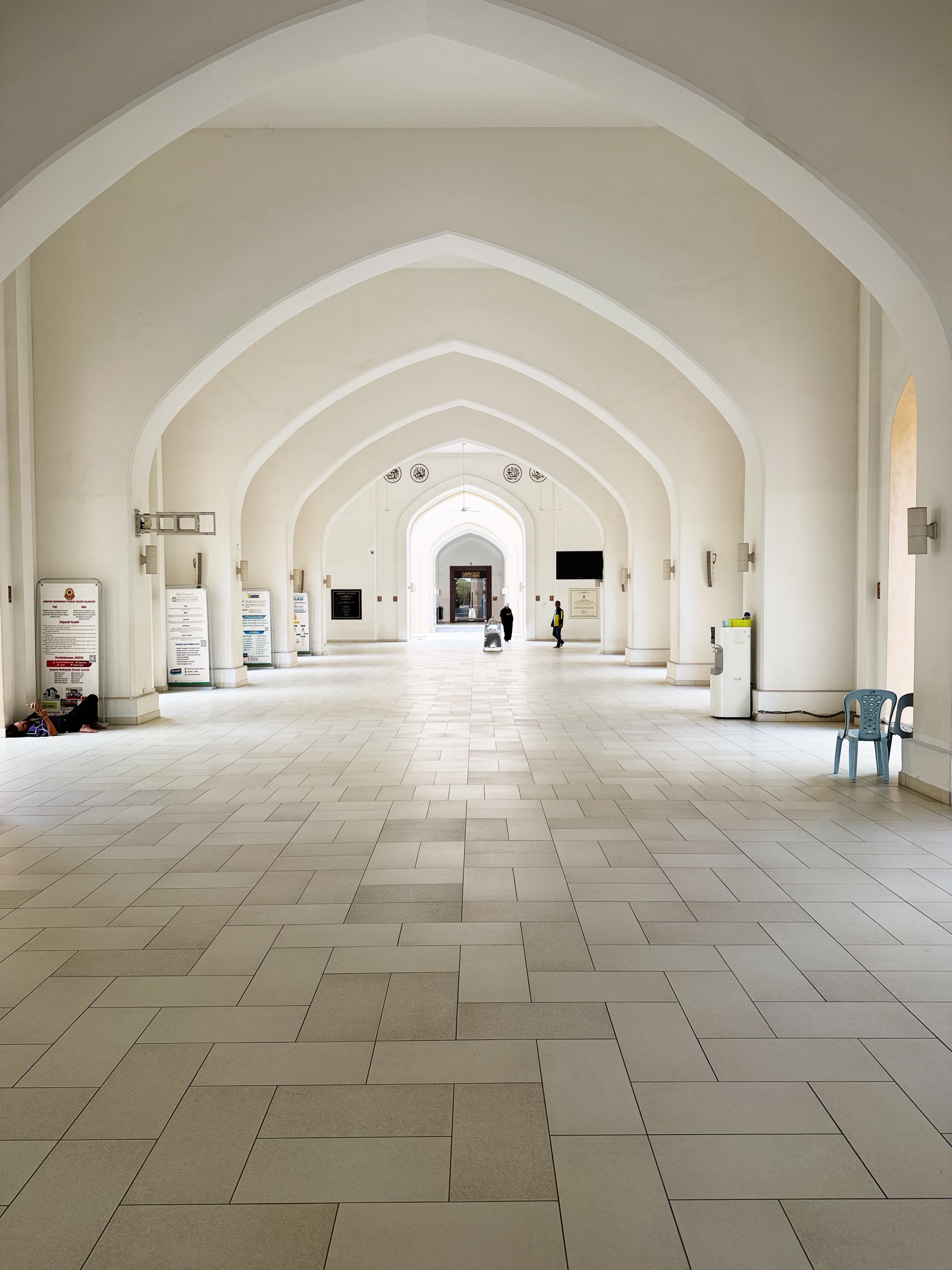 Symmetrical interior view of a modern archway in Shah Alam highlighting architectural beauty.