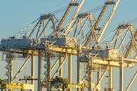 Industrial Port Cranes at Sunset in Harbor