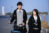 Young Couple Walking by the River in Zhengzhou