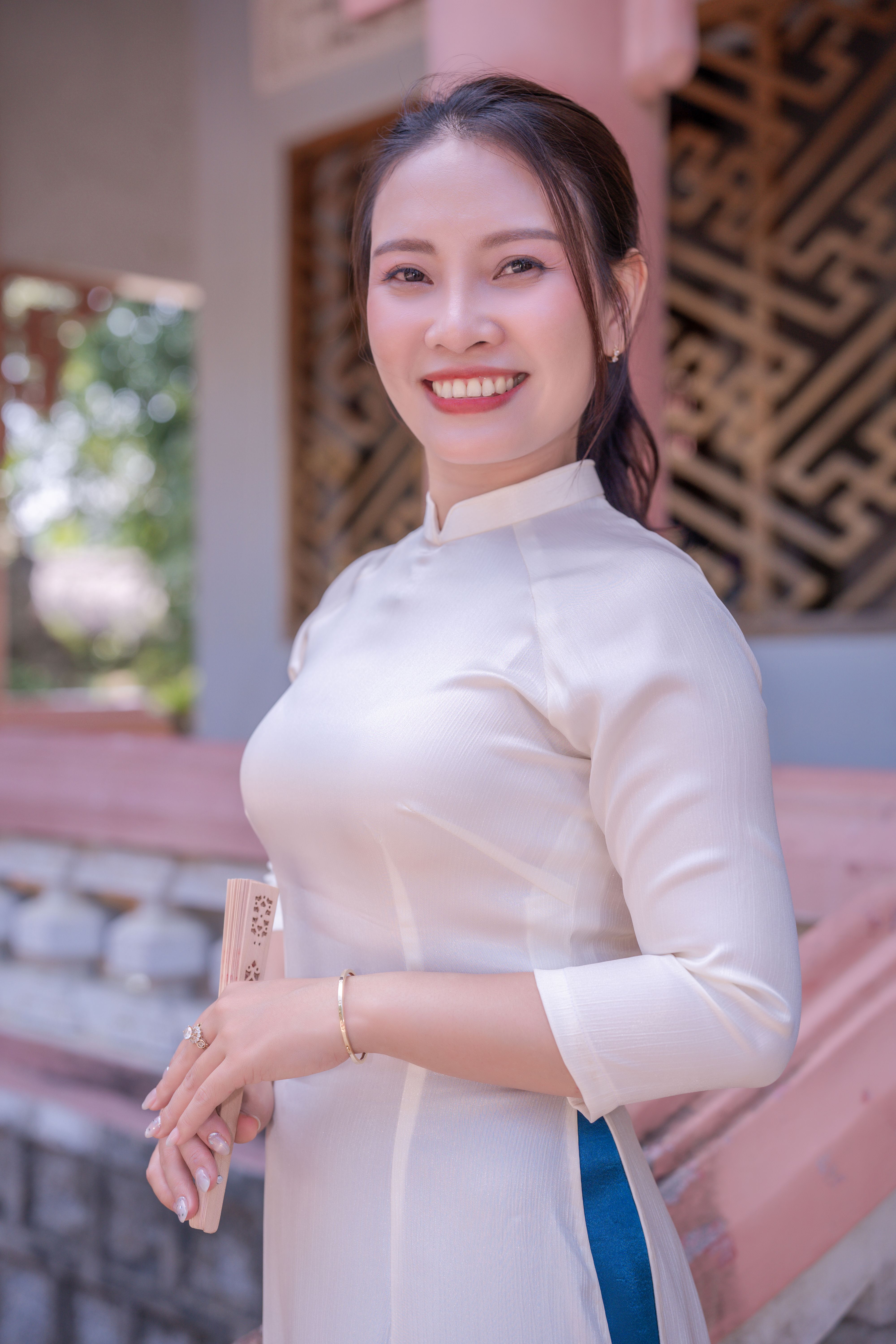 Portrait of Smiling Woman in Traditional Attire · Free Stock Photo