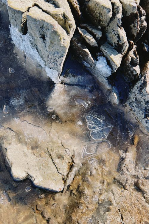 Free Ice-covered rocks showcasing intricate natural formations in winter. Stock Photo