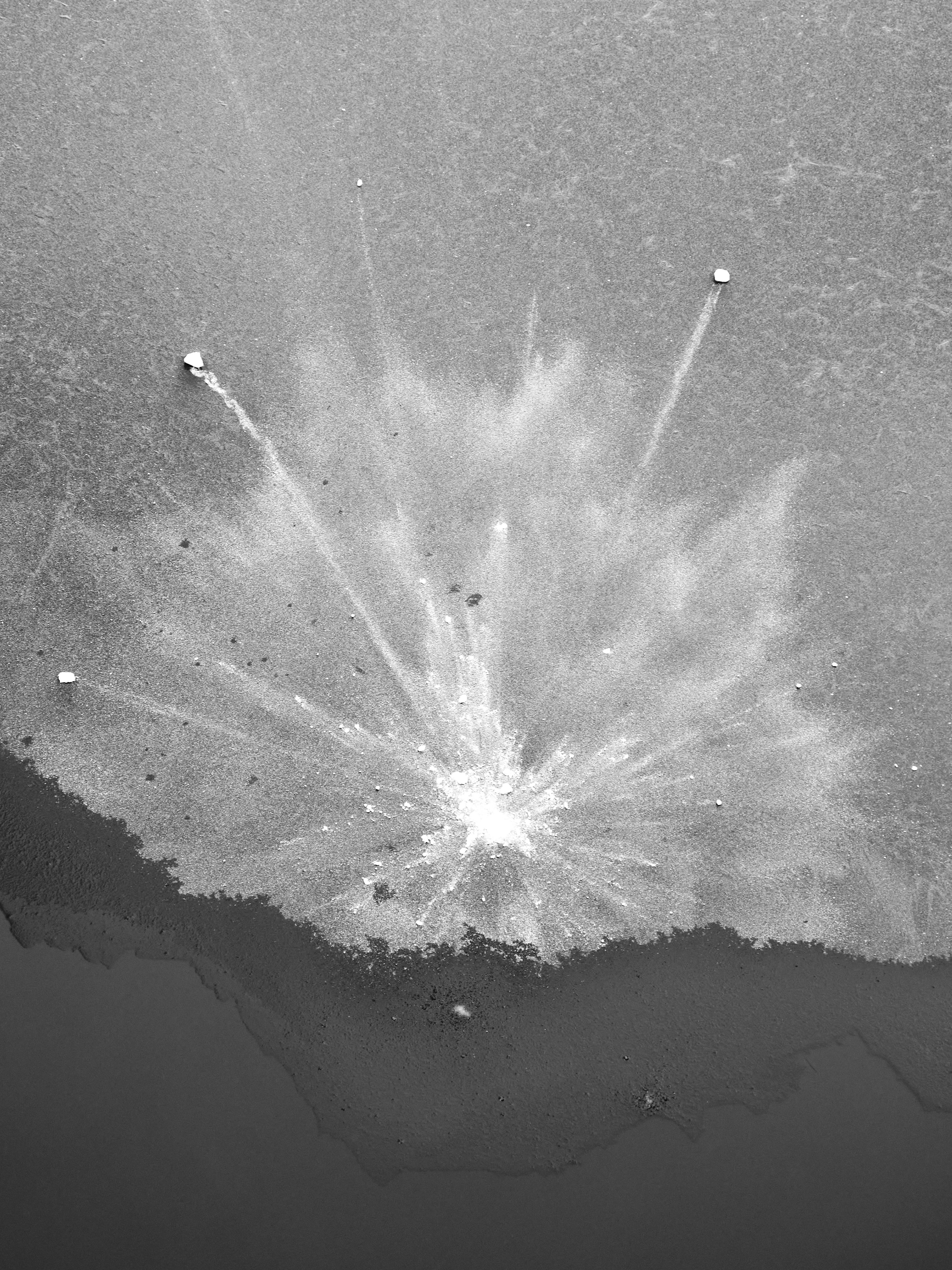 Aerial view of a splash pattern on a frozen lake in Hamburg, Germany.