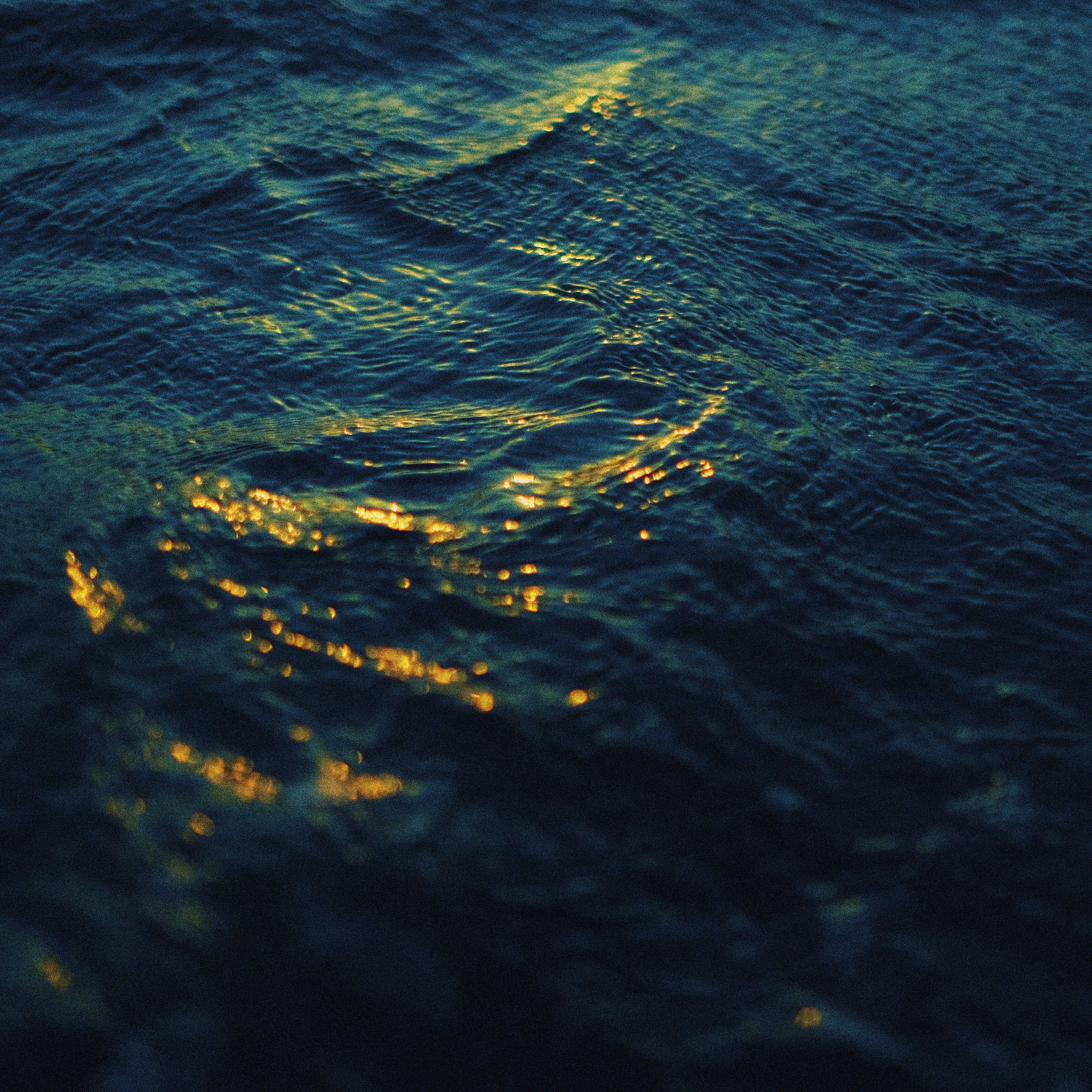 Golden Light on Ocean Waves at Twilight · Free Stock Photo