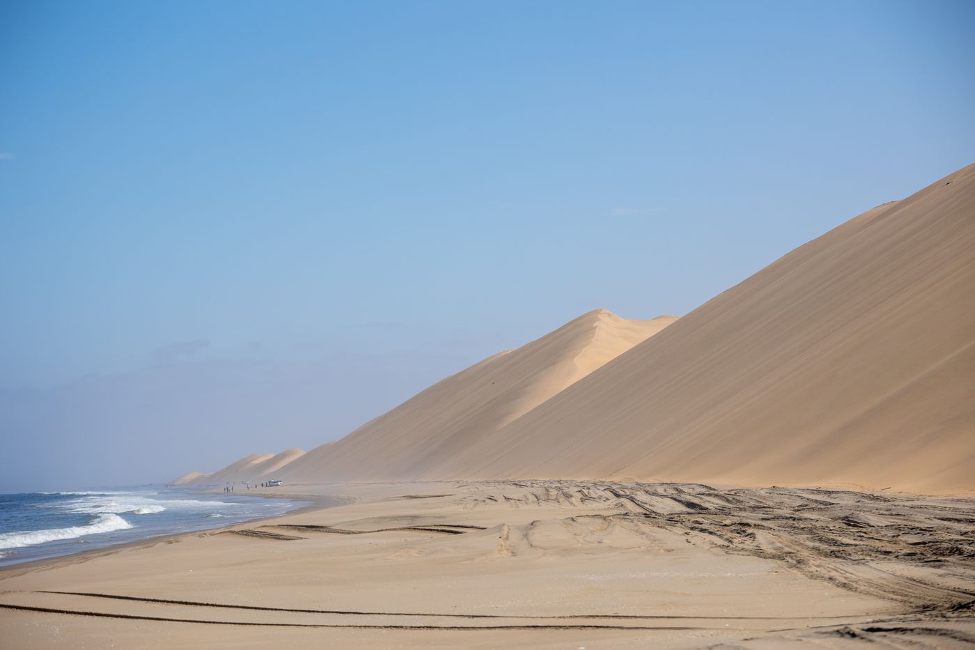 Sand dunes meeting the Atlantic Ocean along the Namibian coast