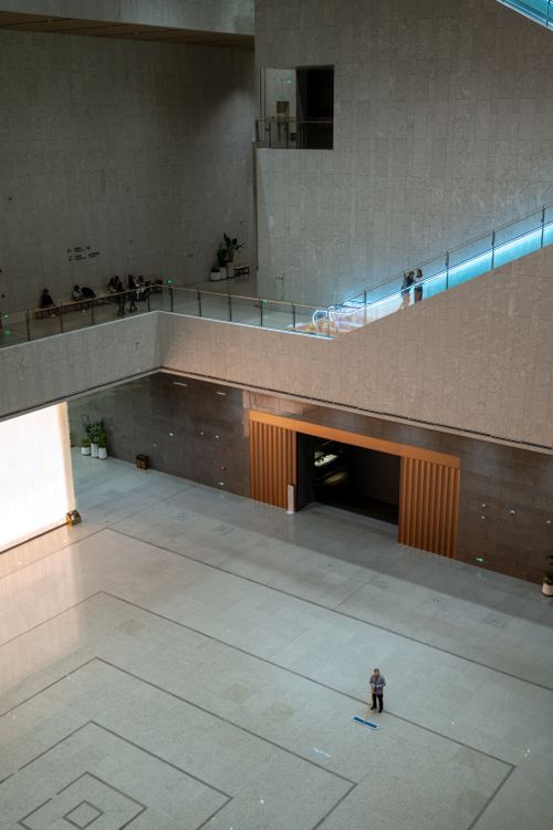 Free Spacious modern interior in Shanghai museum with person standing alone. Stock Photo