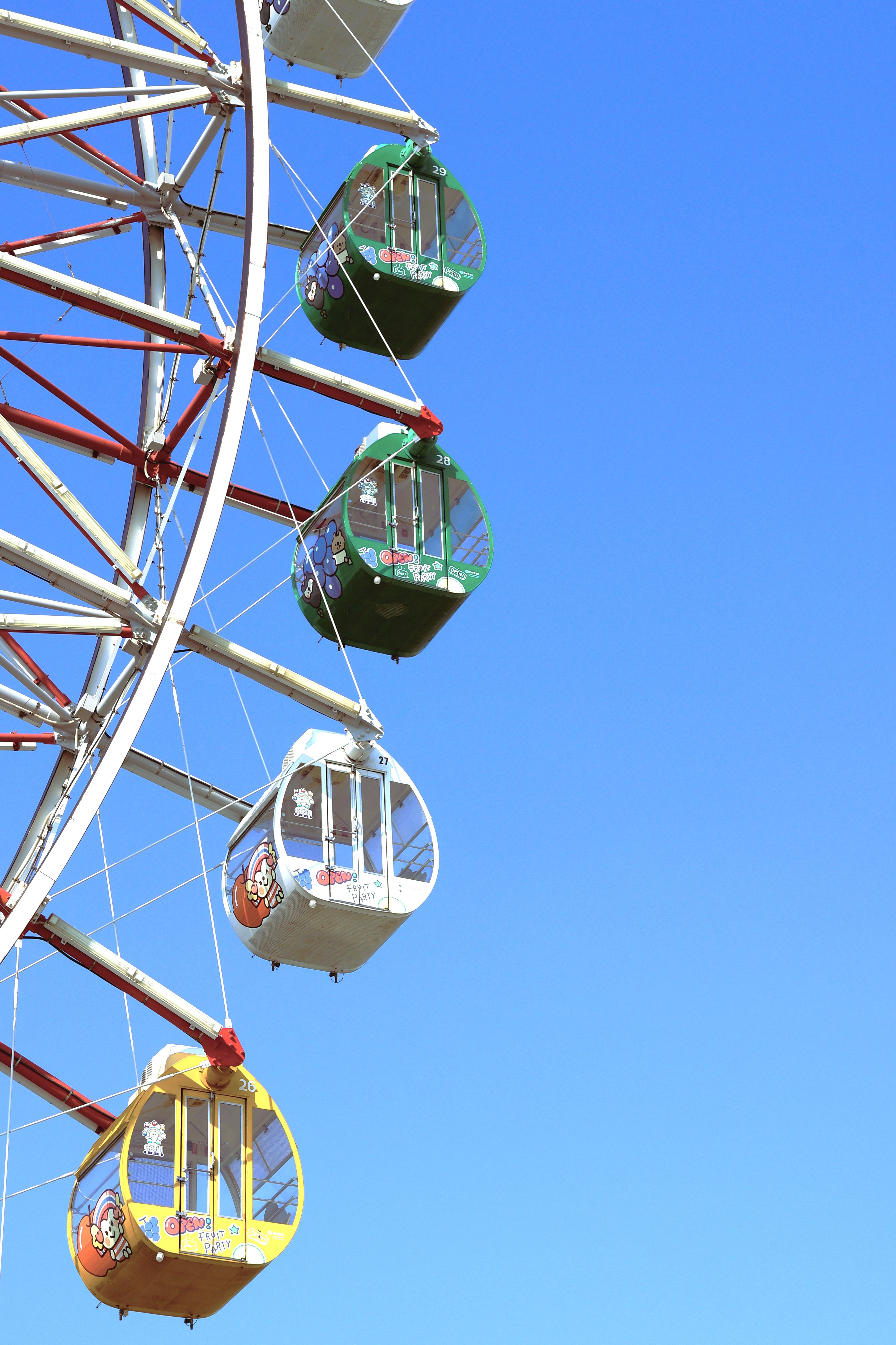 Colorful Ferris Wheel Against Clear Blue Sky · Free Stock Photo