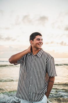 Happy young adult enjoying a sunset at Melbourne Beach, Florida.