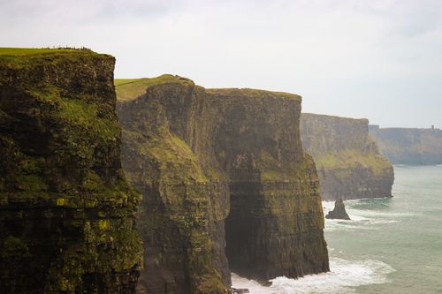Free Stunning view of the Cliffs of Moher with the Atlantic Ocean waves crashing below. Stock Photo