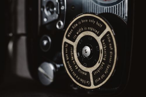 Free Detailed view of a classic camera film mechanism with text on the dial. Stock Photo