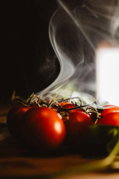 Free Artistic photo of fresh red tomatoes with a dramatic smoke effect. Stock Photo