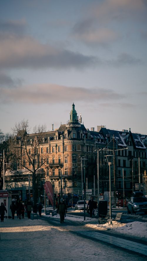 Free A scenic winter view of Stockholm's historic architecture and busy streets. Stock Photo