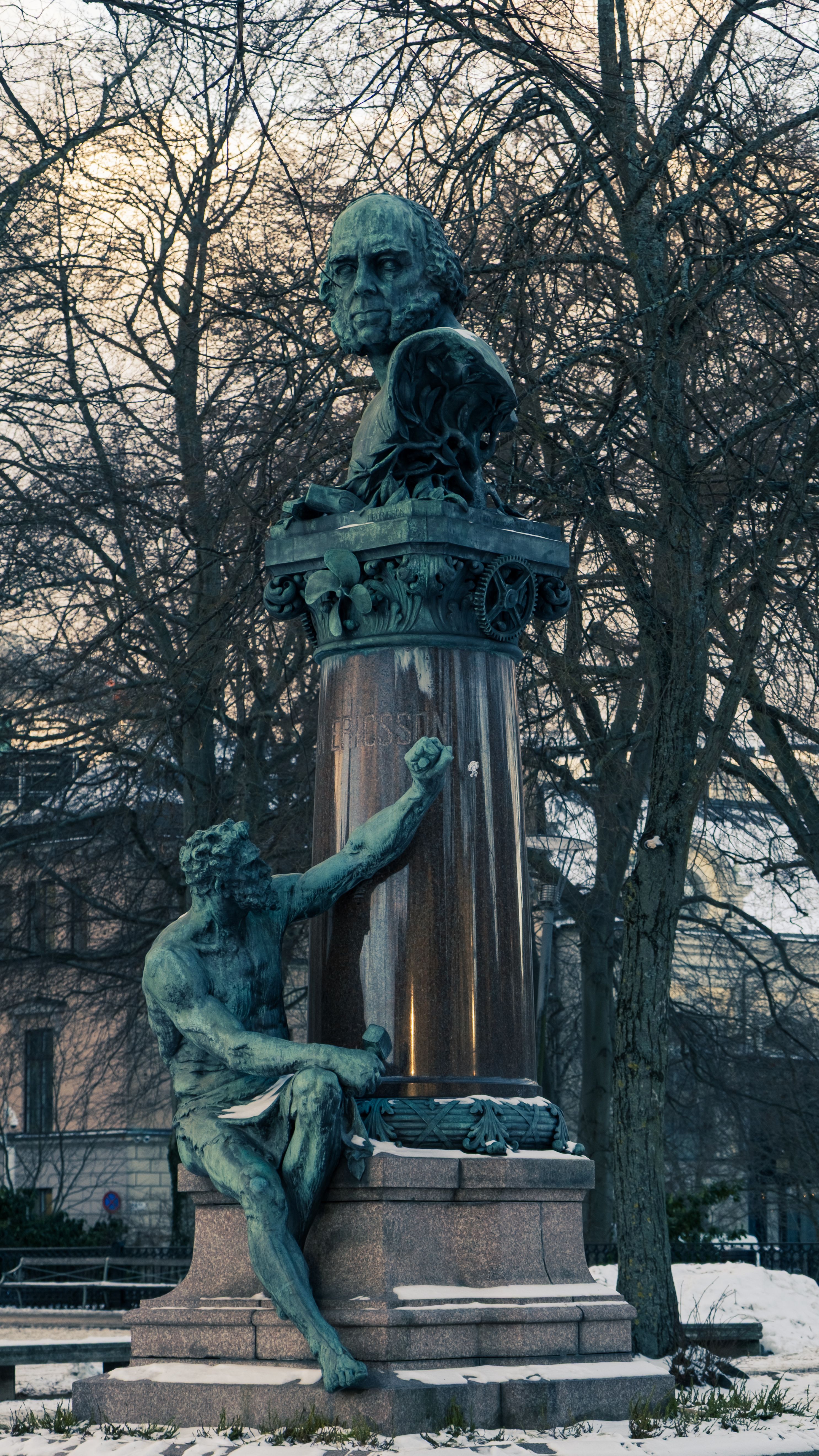 Bronze monument of Carl Linnaeus at Humlegården Park in winter, Stockholm, Sweden.