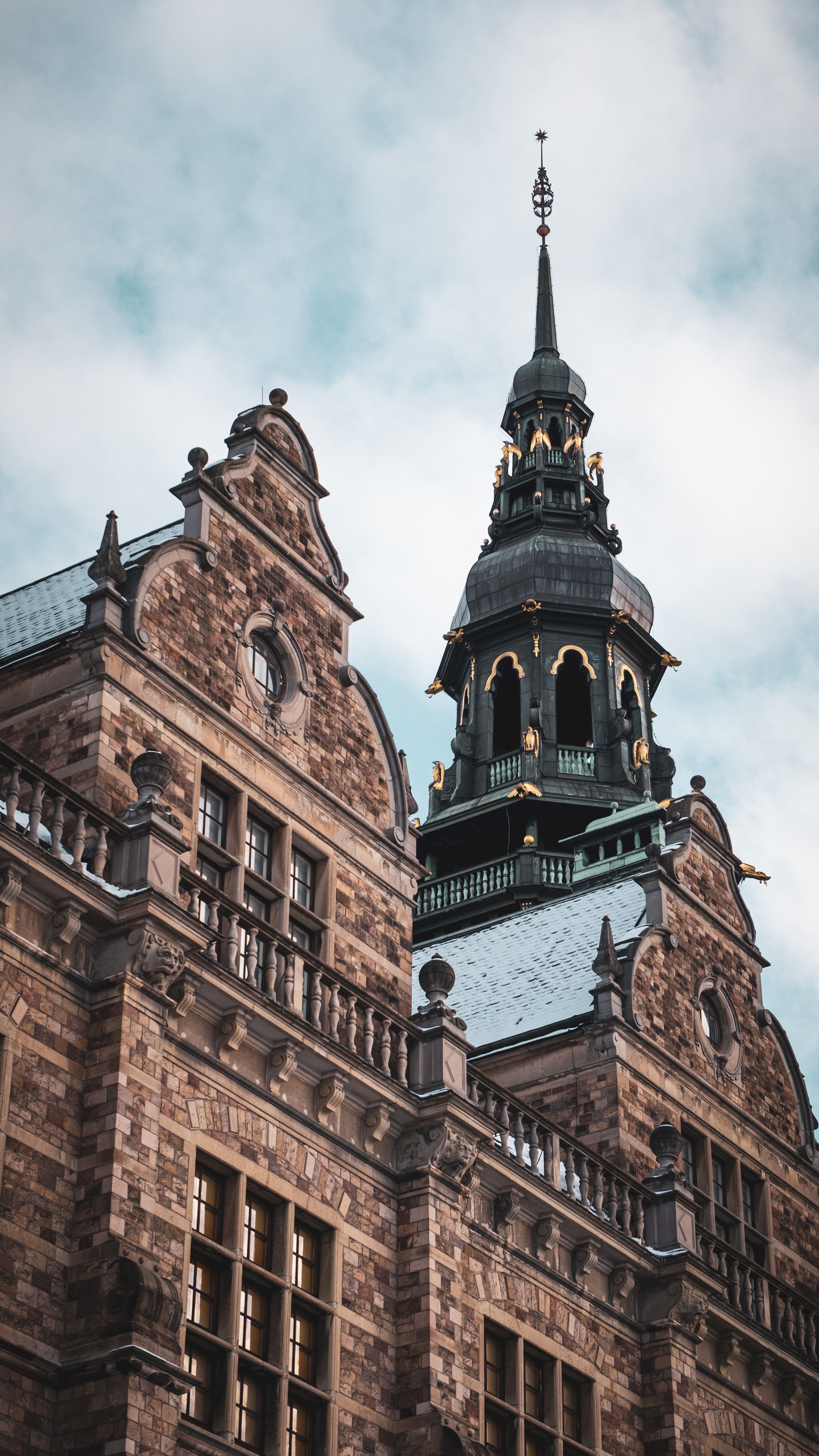 Nordic Museum Tower Against Cloudy Sky in Stockholm · Free Stock Photo