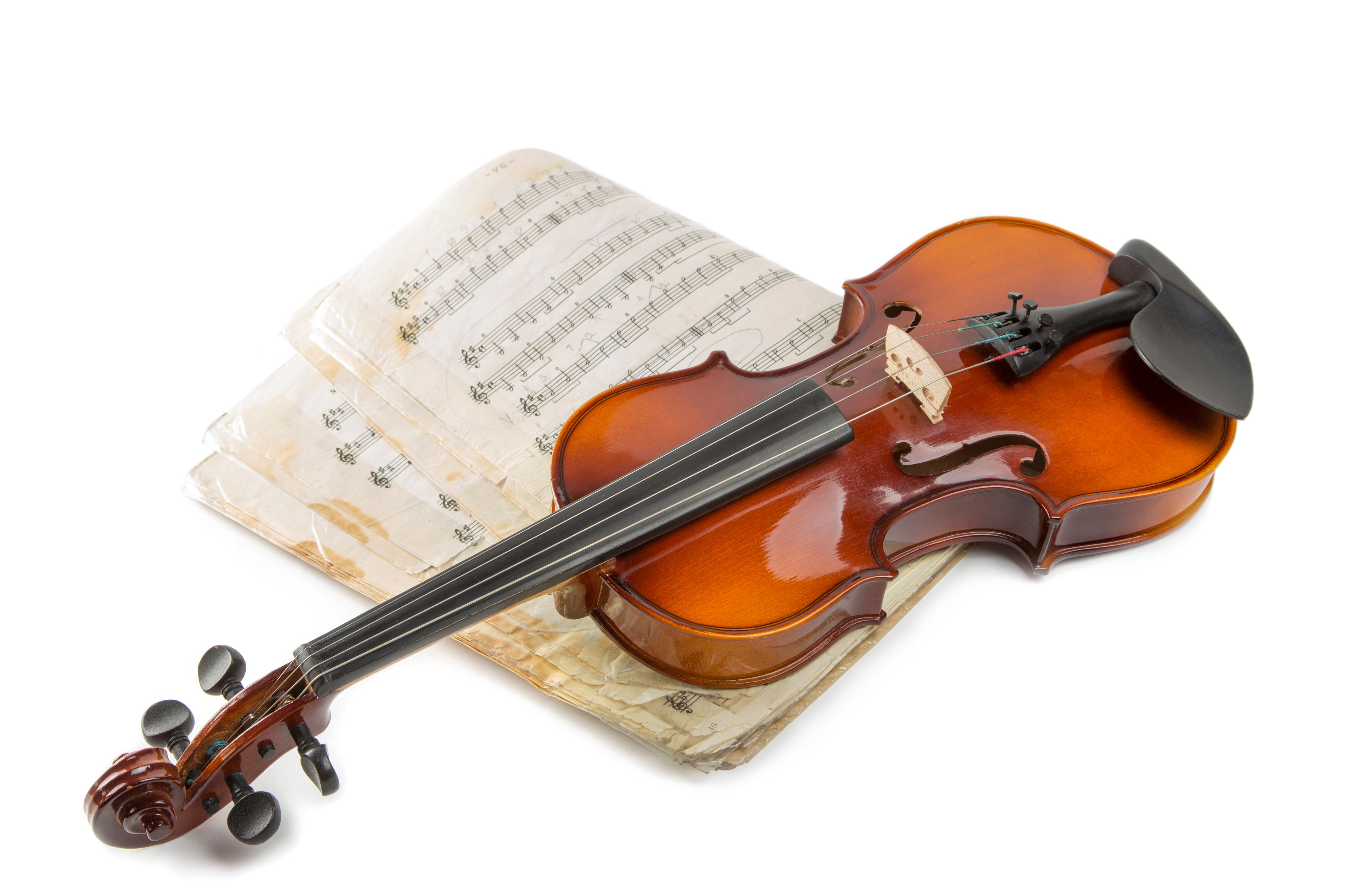 Classical Violin with Sheet Music on White Background · Free Stock Photo