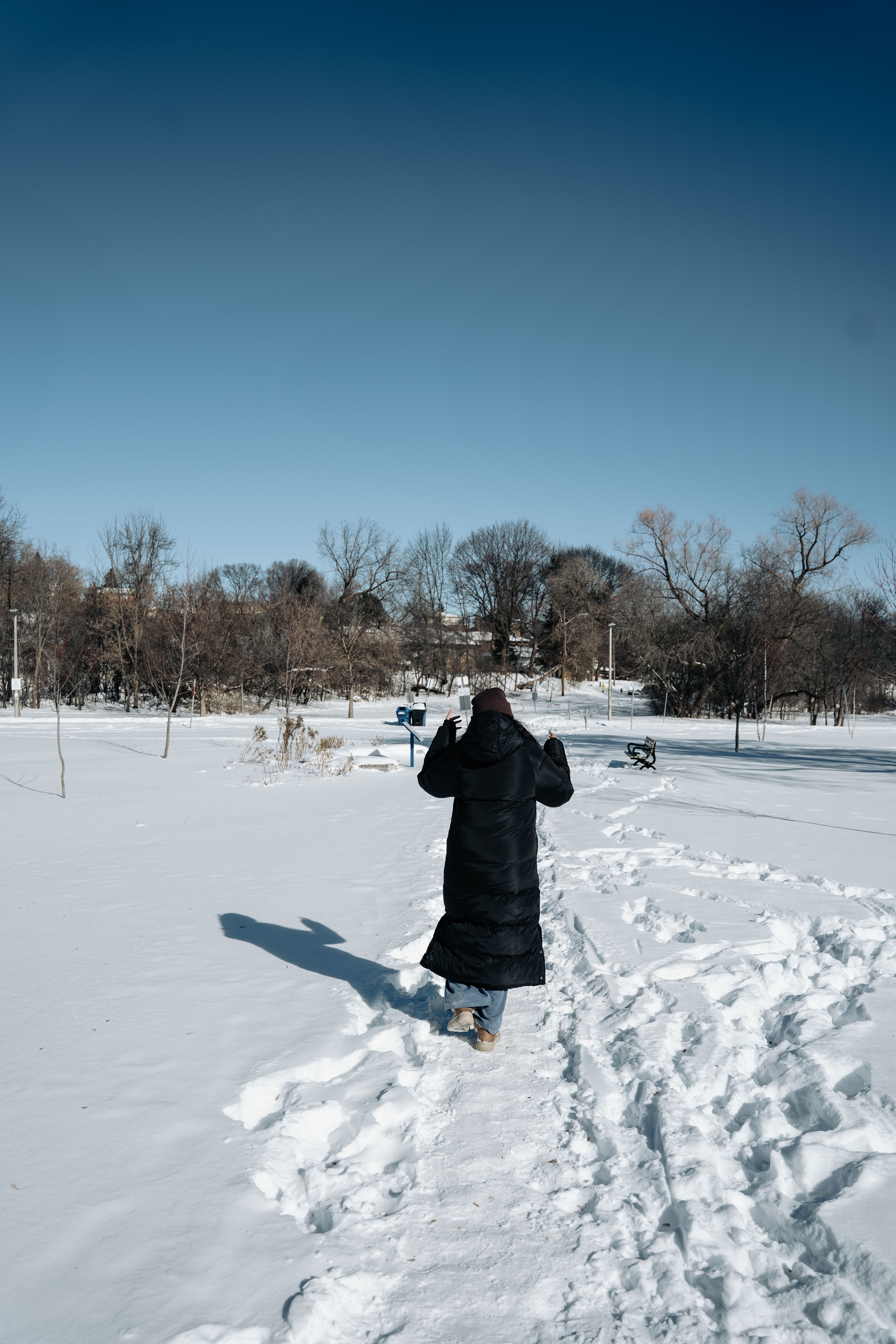 Person Walking on Winter Snowy Path Outdoors · Free Stock Photo
