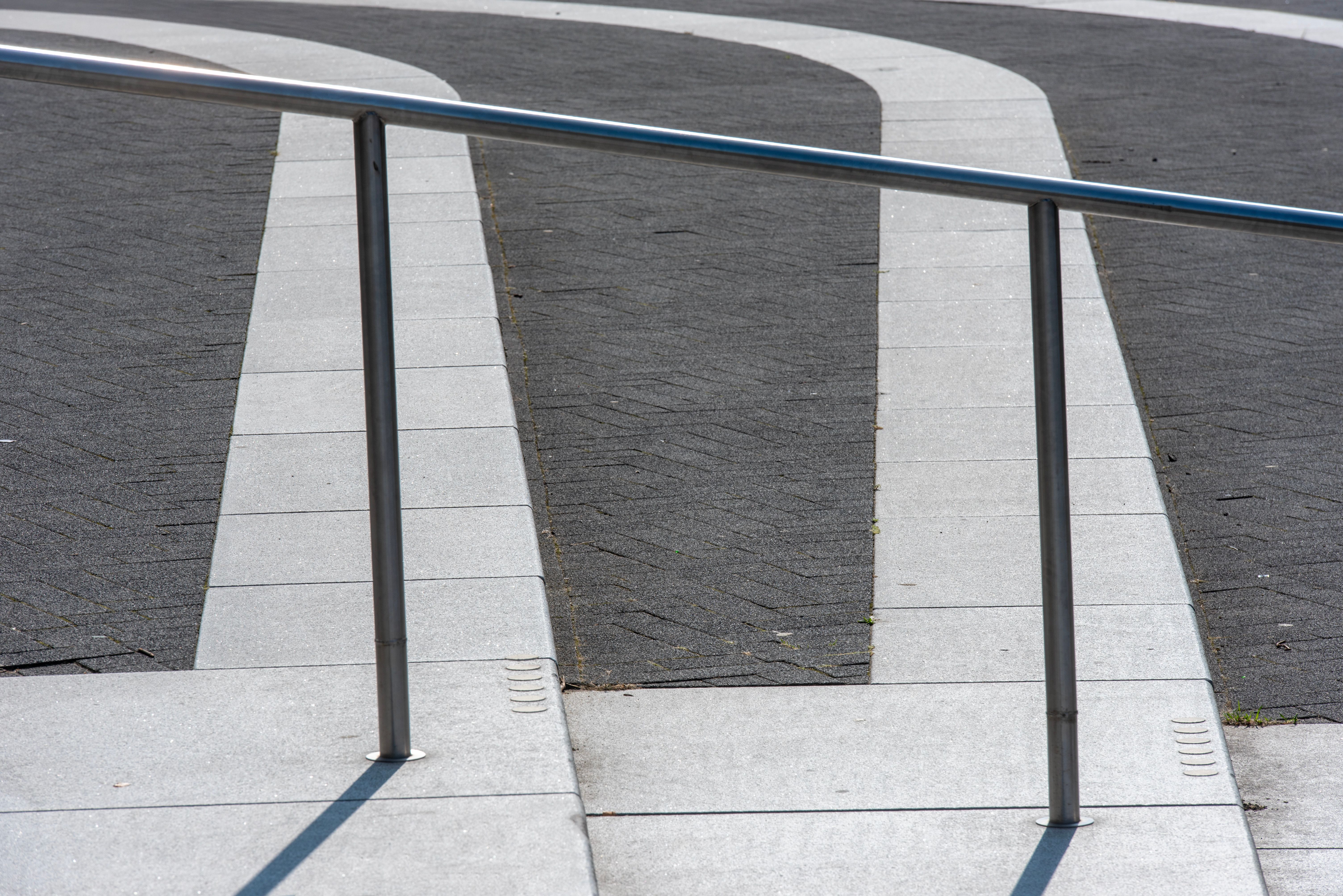 Modern Urban Railing on Curved Pathway · Free Stock Photo