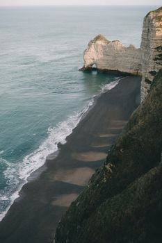 Stunning view of the famous cliffs in Étretat, Normandy, featuring the natural rock arch and sea.