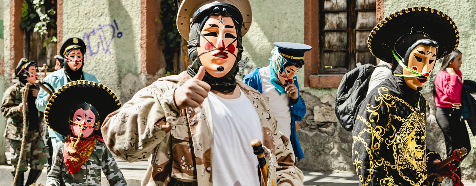 Vibrant costumed participants in a traditional street parade in Pachuca de Soto, Mexico.