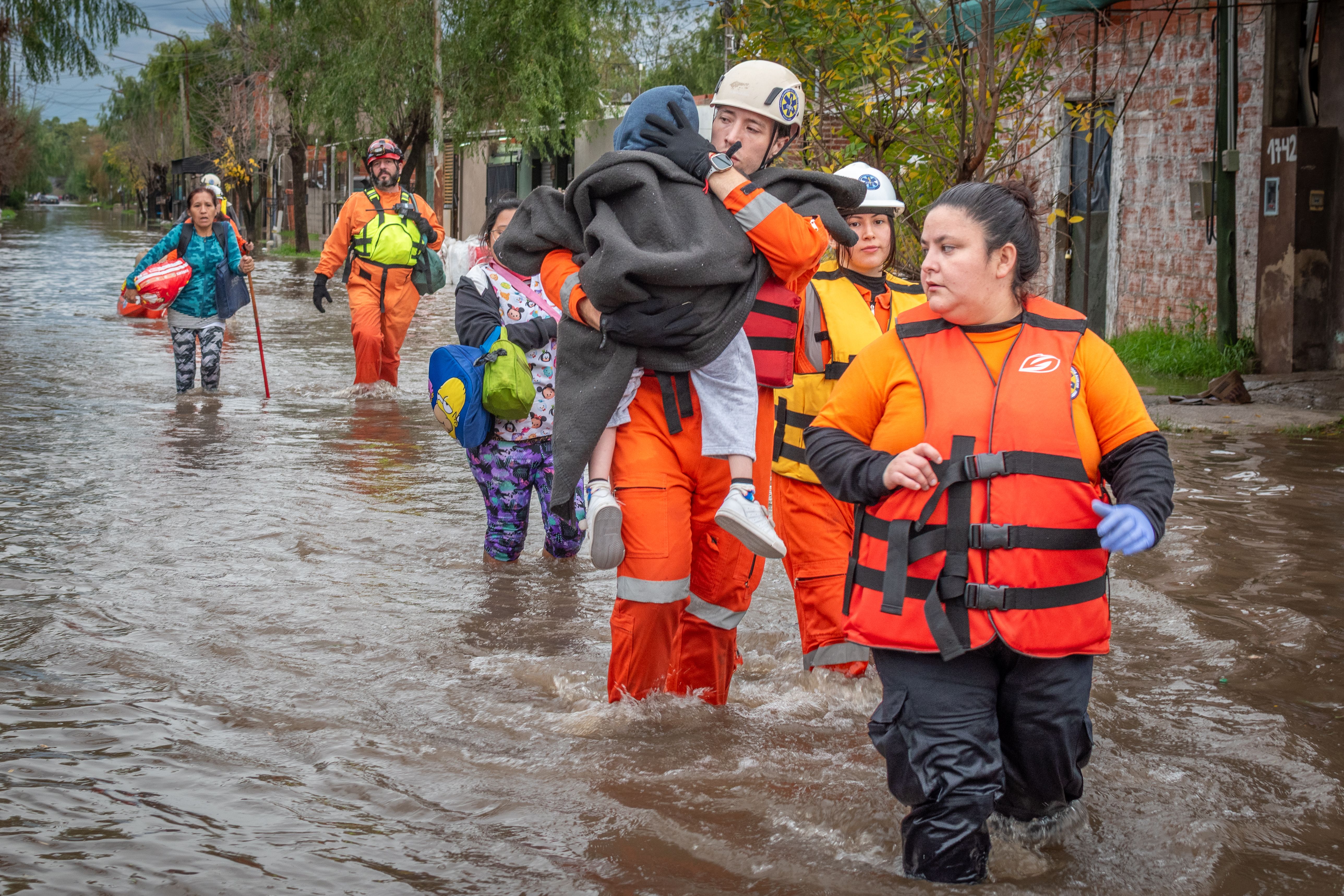 Rescue Team Assisting Flood Victims in Action · Free Stock Photo