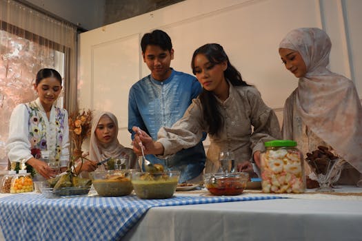 Group of friends sharing a festive meal together indoors, celebrating with traditional dishes.