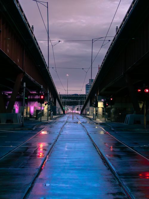 Free Dramatic urban street scene with reflections and lights during dusk. Stock Photo
