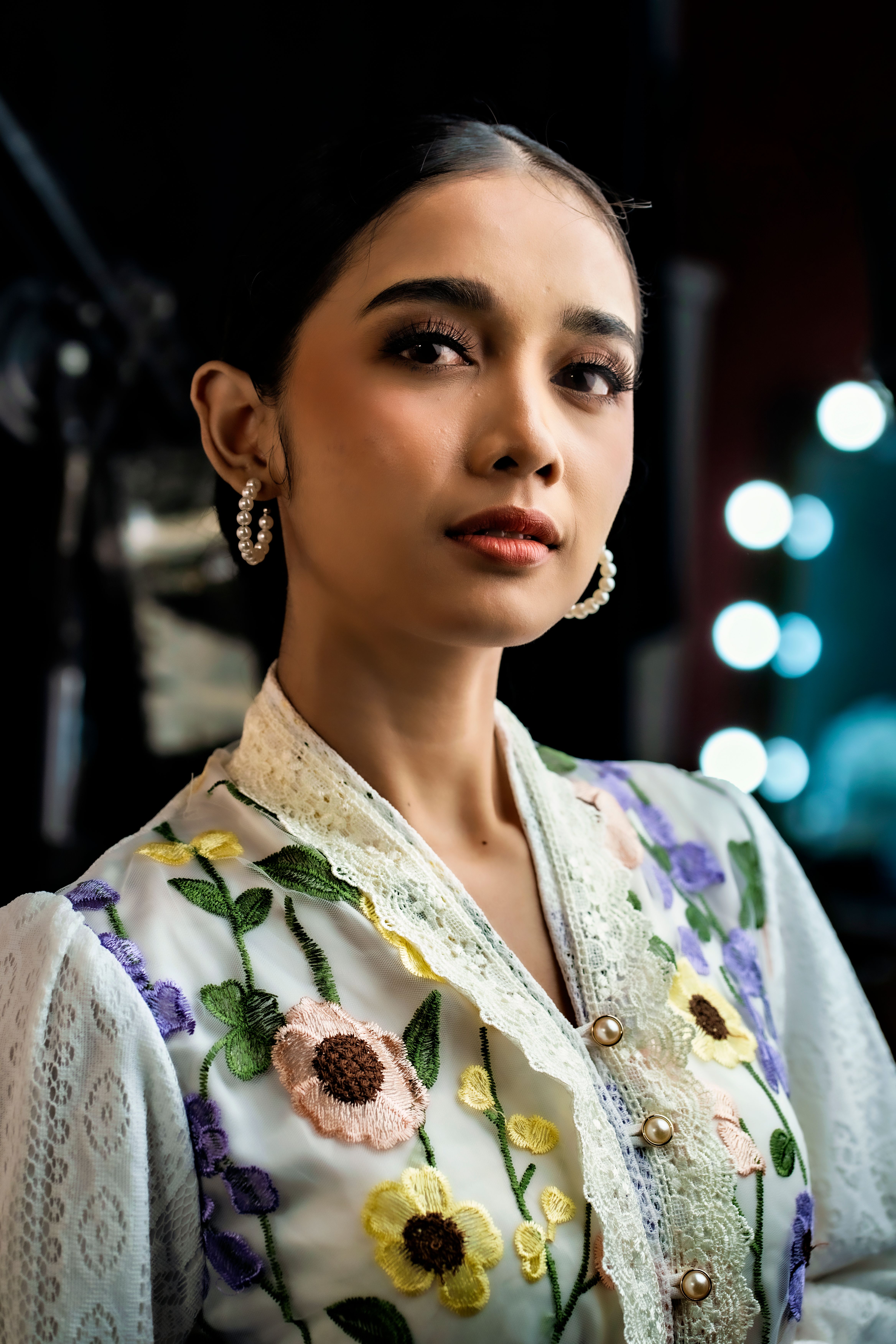 Elegant Portrait of Woman in Floral Attire · Free Stock Photo