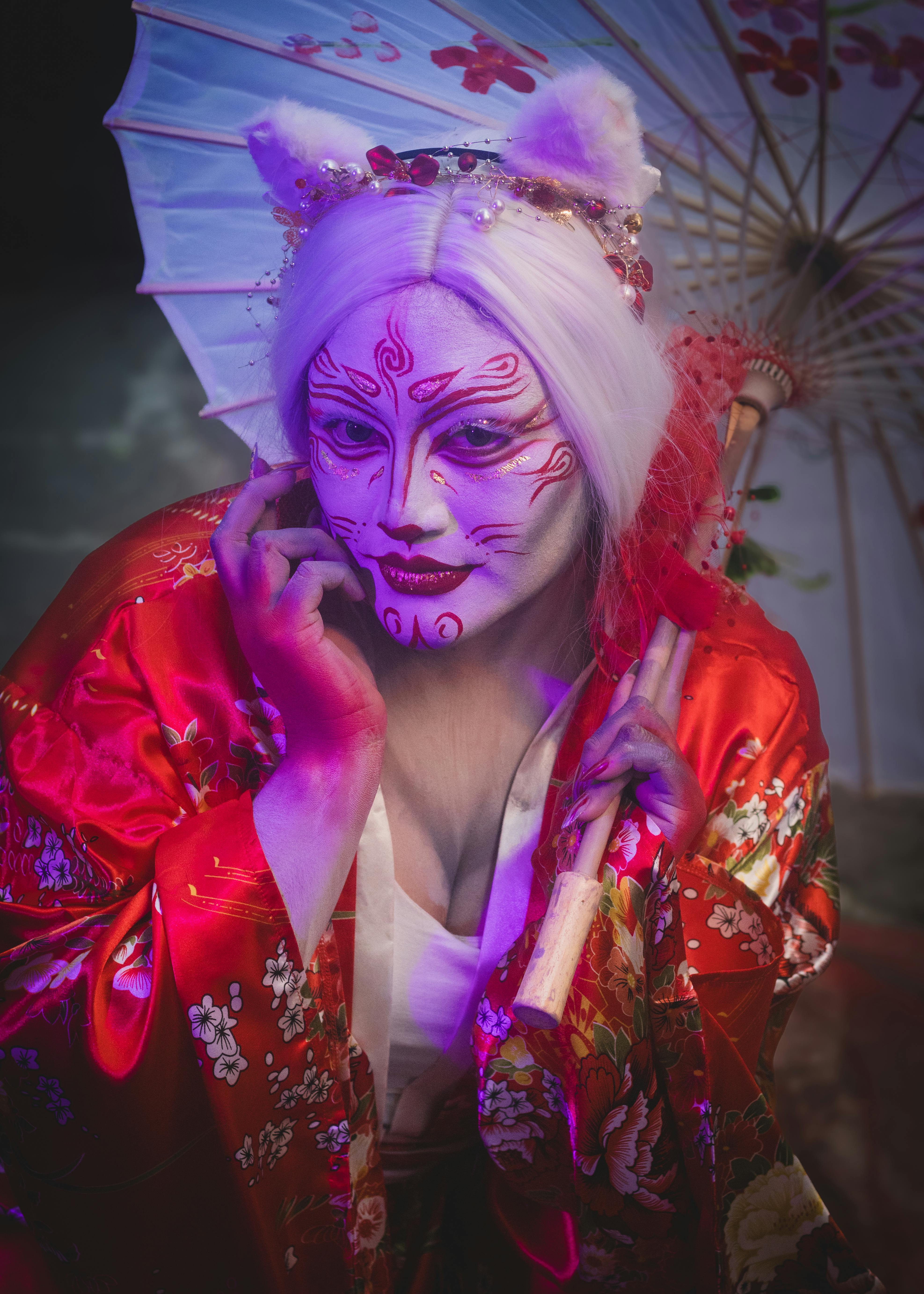 Free Artistic portrait of a geisha-inspired character with traditional parasol and kimono, vibrant and colorful. Stock Photo