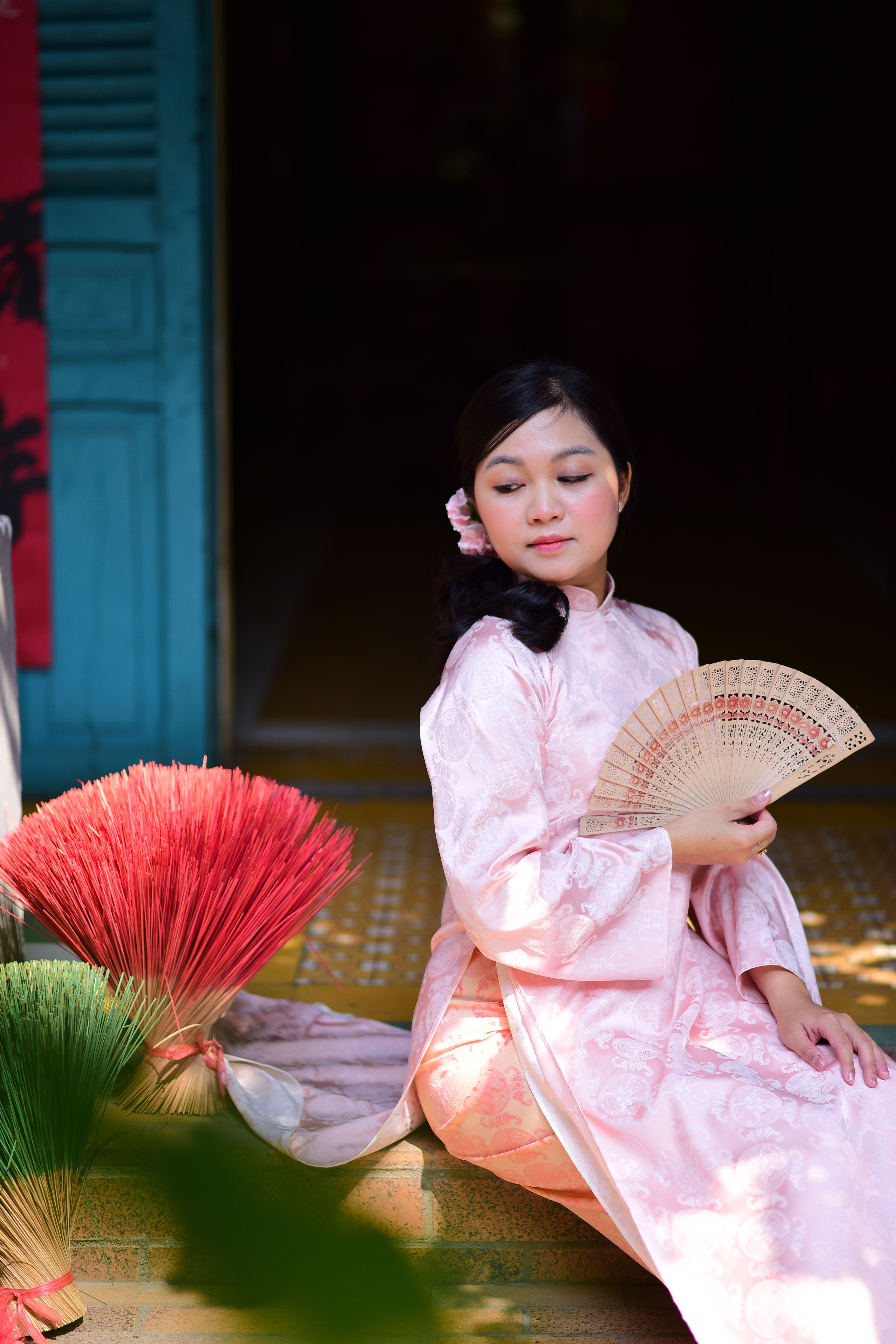 Elegant Woman in Traditional Pink Dress with Fan · Free Stock Photo