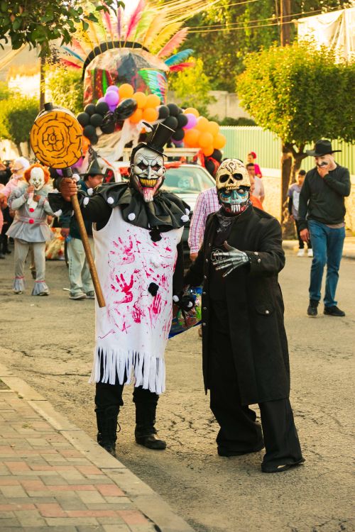 Free Festive Día de Muertos parade with costumed participants in Lerma de Villada, Mexico. Stock Photo