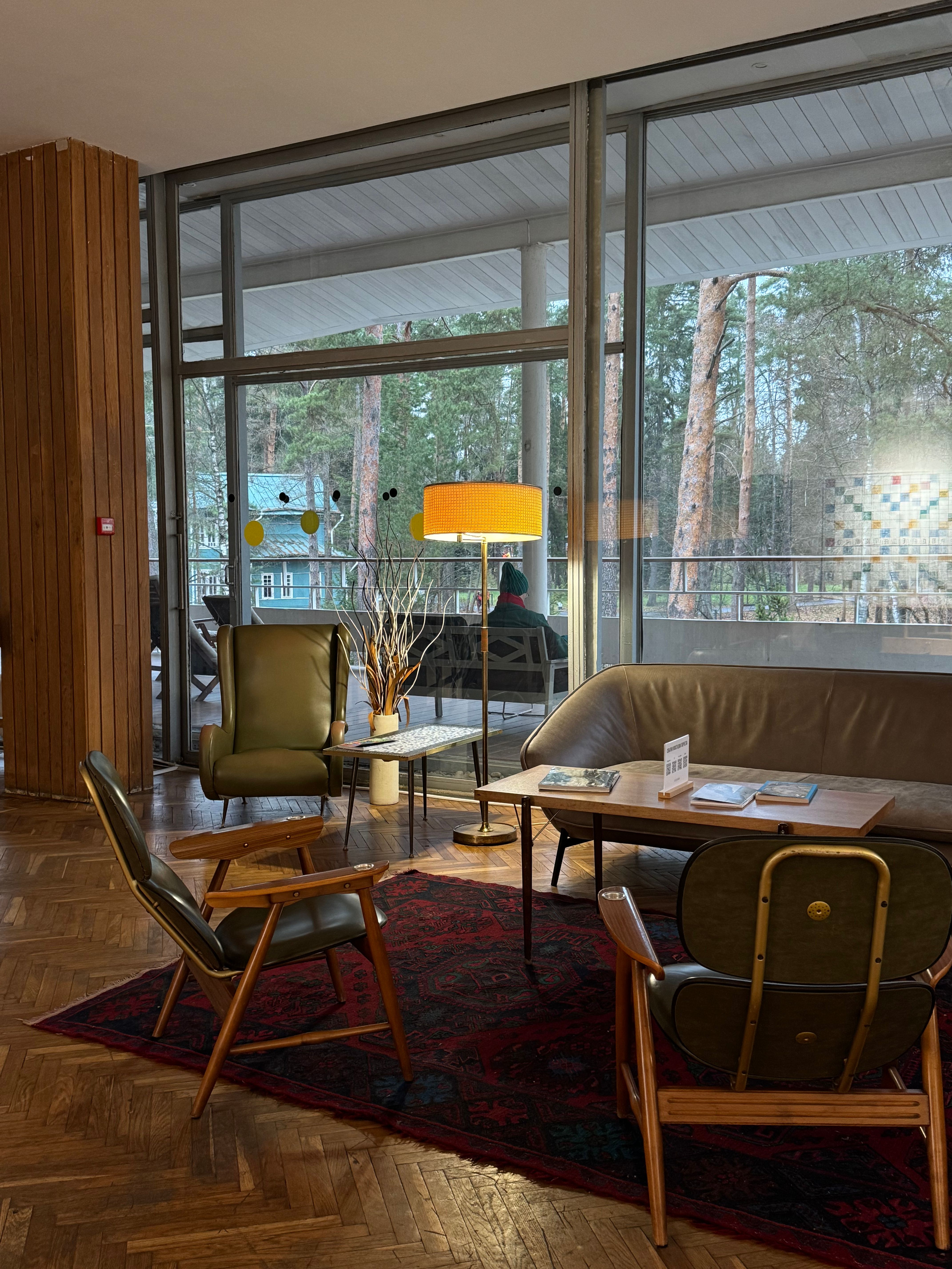 Cozy modern living room with mid-century furniture and large windows showing a forest view.. pexels, cozy, modern