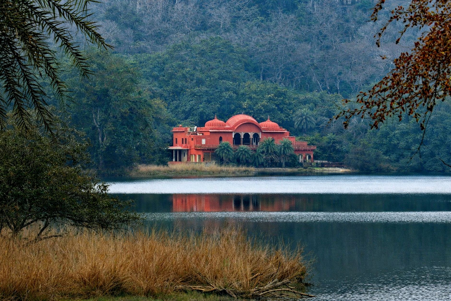 A picturesque hunting lodge by a tranquil lake in Ranthambore, Rajasthan, India.