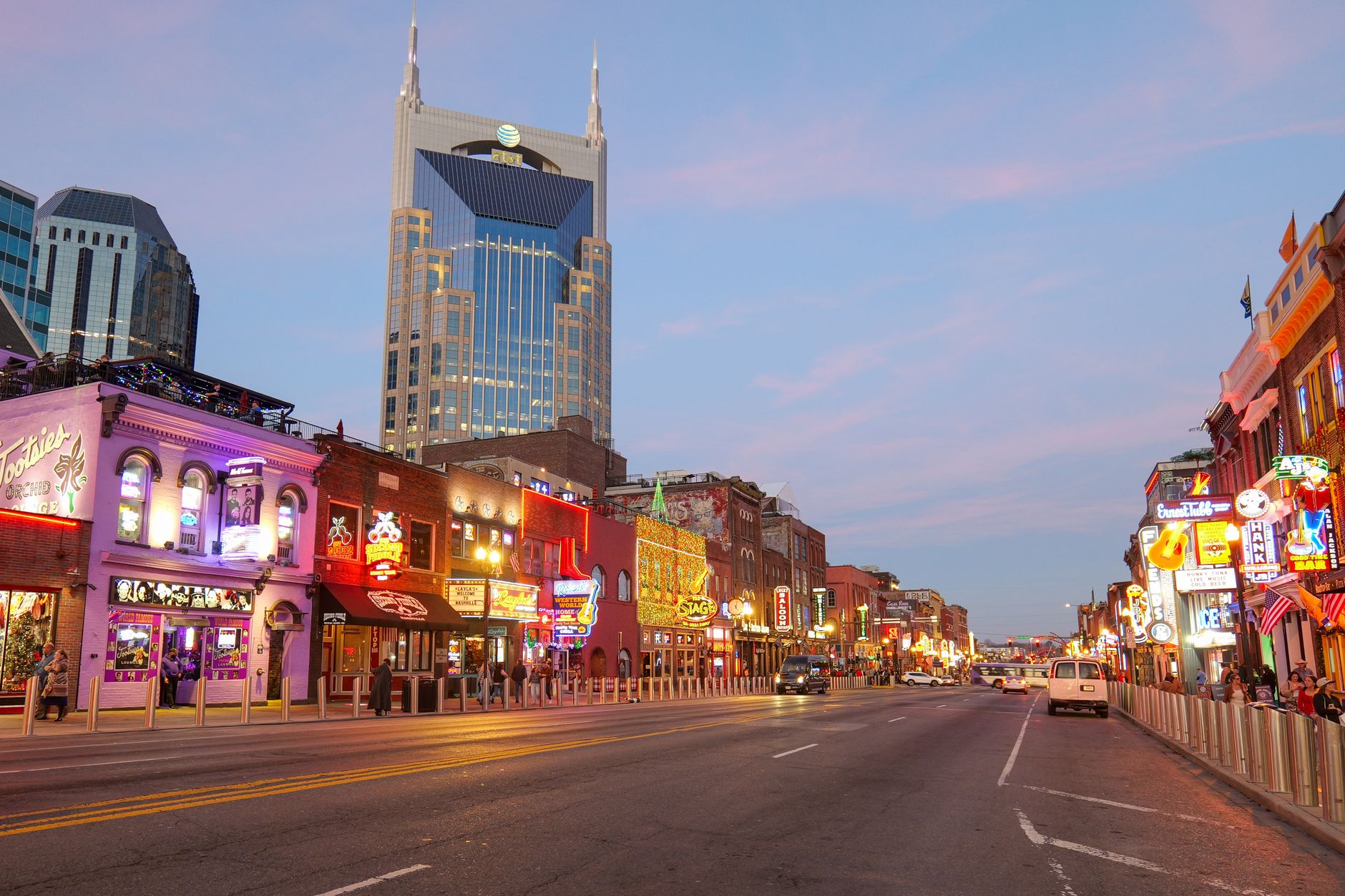 Explore the lively streets of Nashville, Tennessee with bright neon signs and iconic architecture.