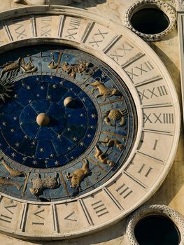 A close-up of the Zodiac signs on the iconic St Mark's Clocktower in Venice, Italy.