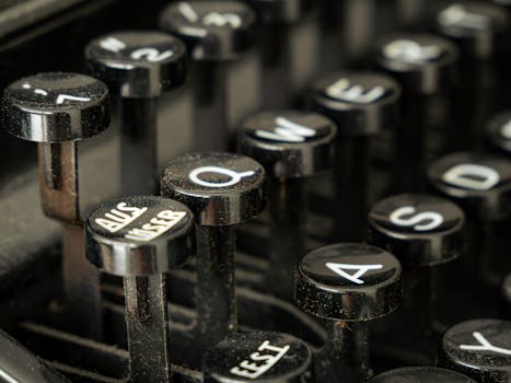 Close-up view of vintage typewriter keys, showcasing classic design and mechanical detail.