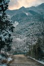 Snow-Covered Mountain Road in Winter Landscape