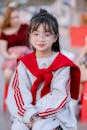 Stylish Young Girl in Red and Grey Outfit