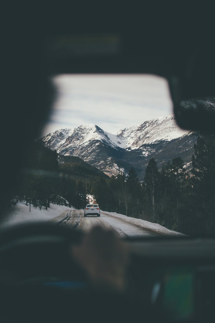 Car Near Green Trees And Mountain