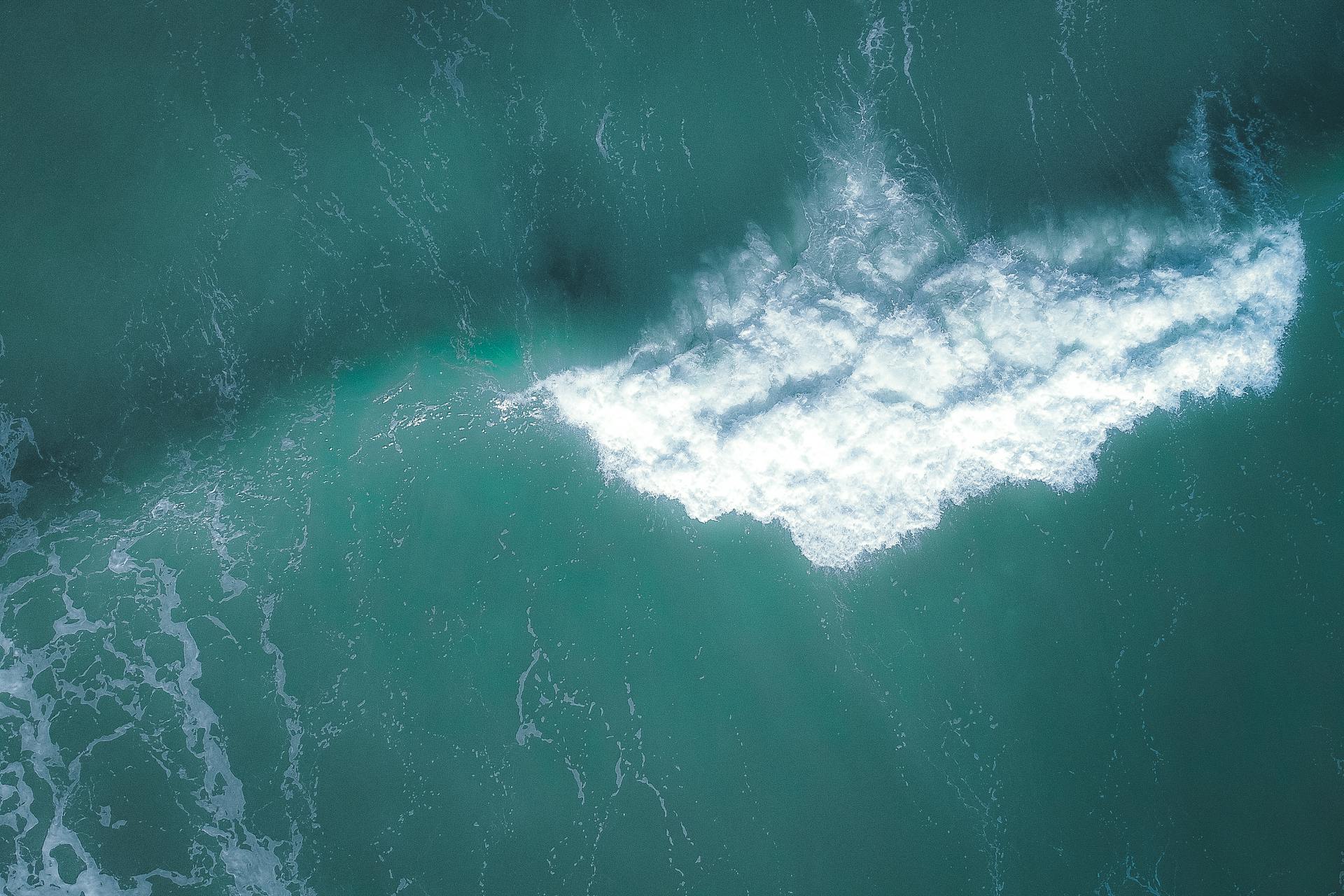 Serene aerial view of ocean waves in Marang, Malaysia capturing natural beauty and tranquility.