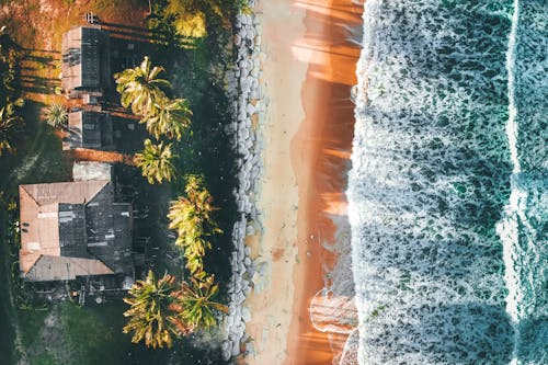 Aerial landscape of tropical resort and powerful waving sea