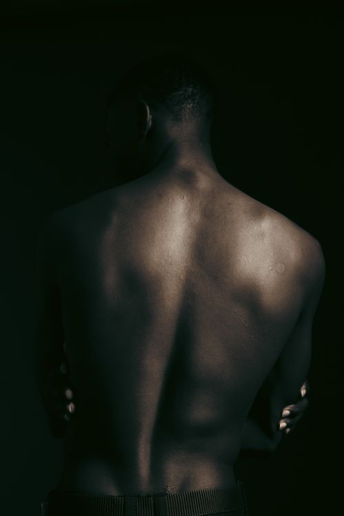 Moody Artistic Portrait of a Man's Back · Free Stock Photo