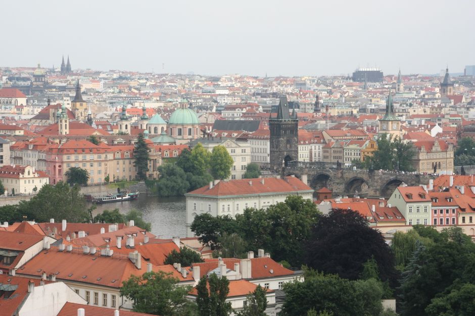Aerial view of Prague featuring Charles Bridge and historic Old Town.