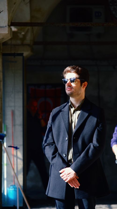 Free Portrait of a fashionable man in sunglasses, standing confidently in an urban location, İstanbul. Stock Photo