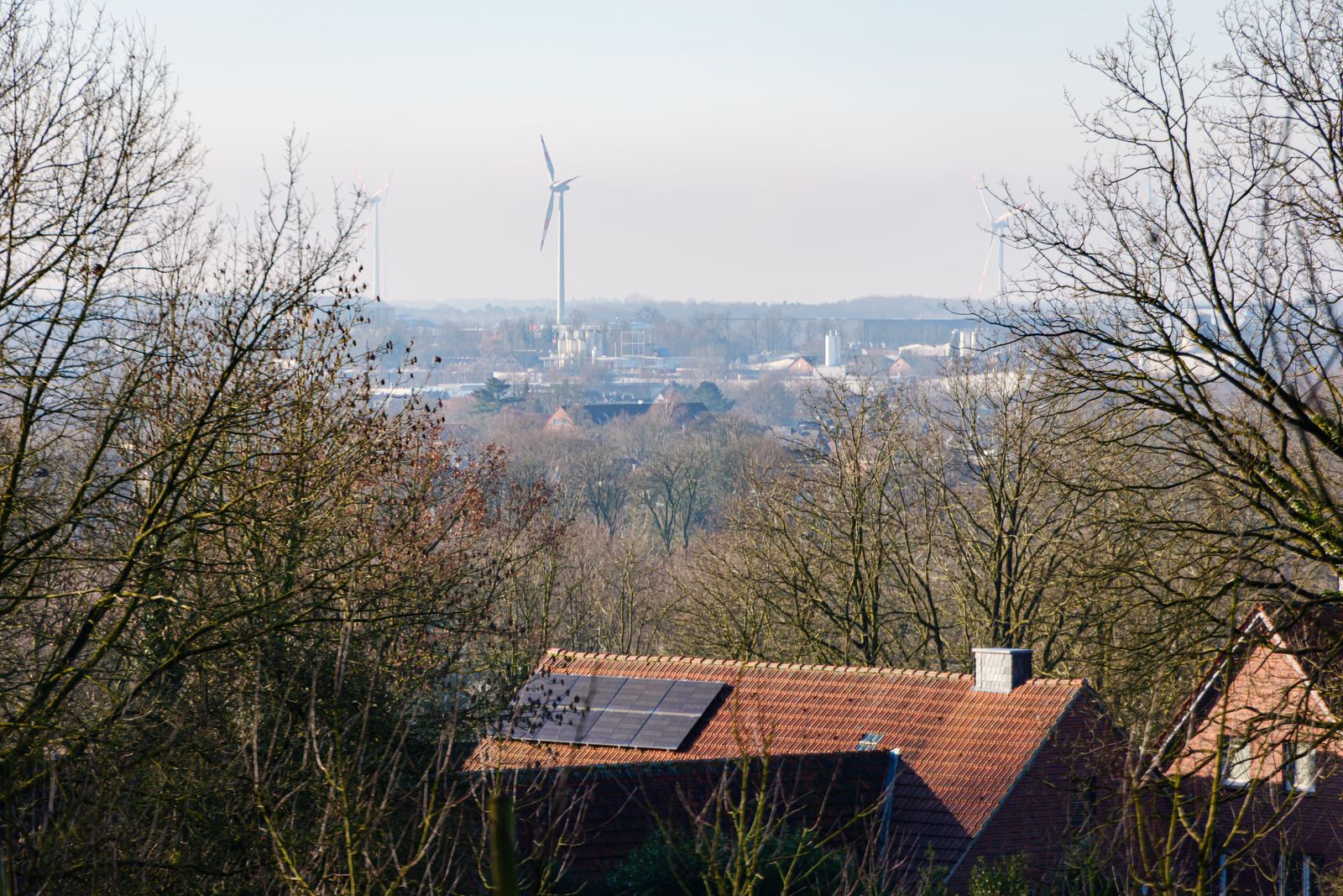Sustainable landscape with solar panels and wind turbines