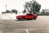 Red Coupe Drifting on Asphalt Road