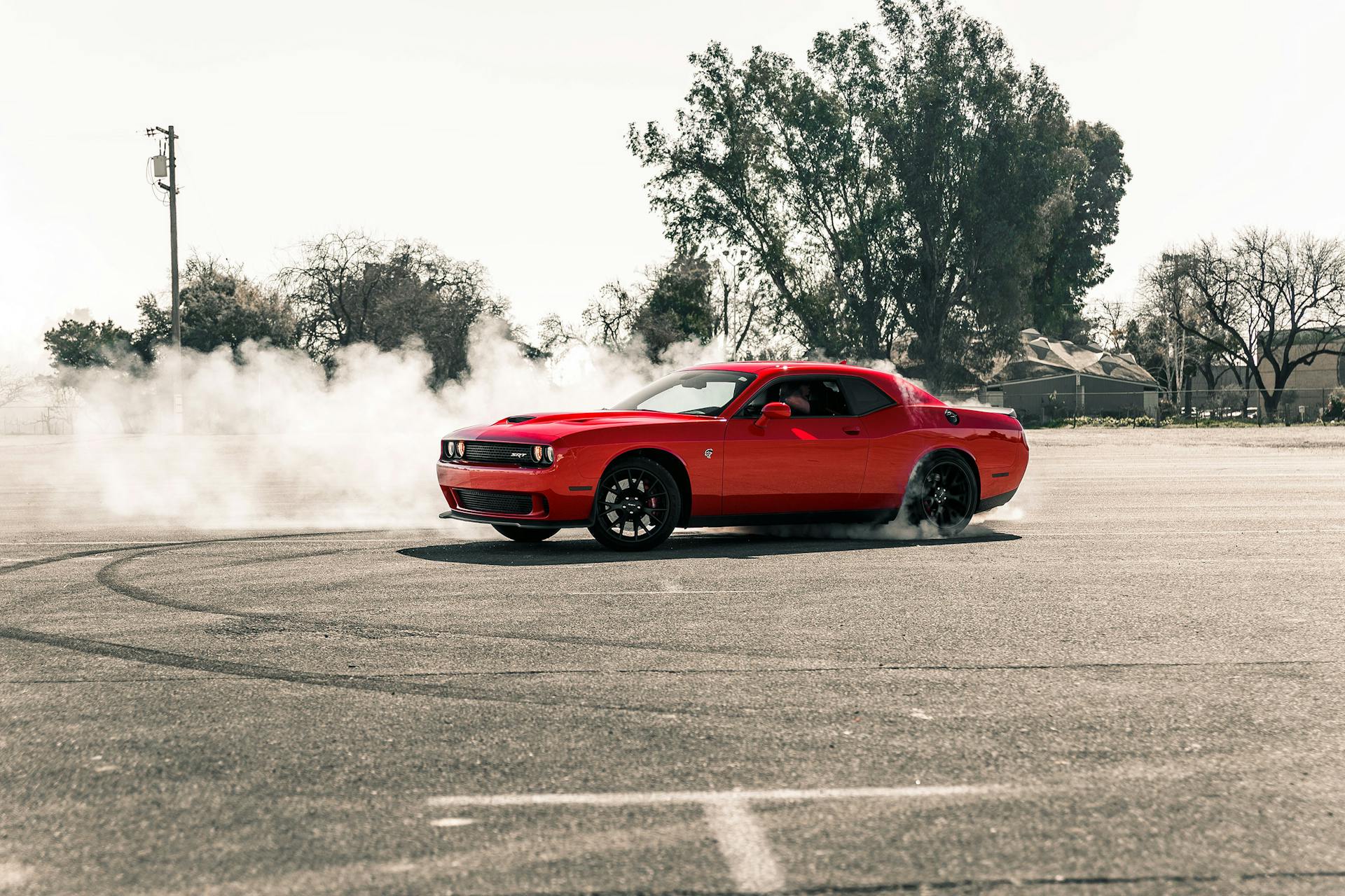 Red Coupe Drifting on Asphalt Road